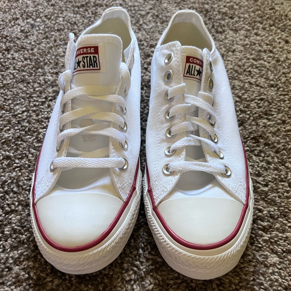 Brand new white Converse low top shoes (never worn)